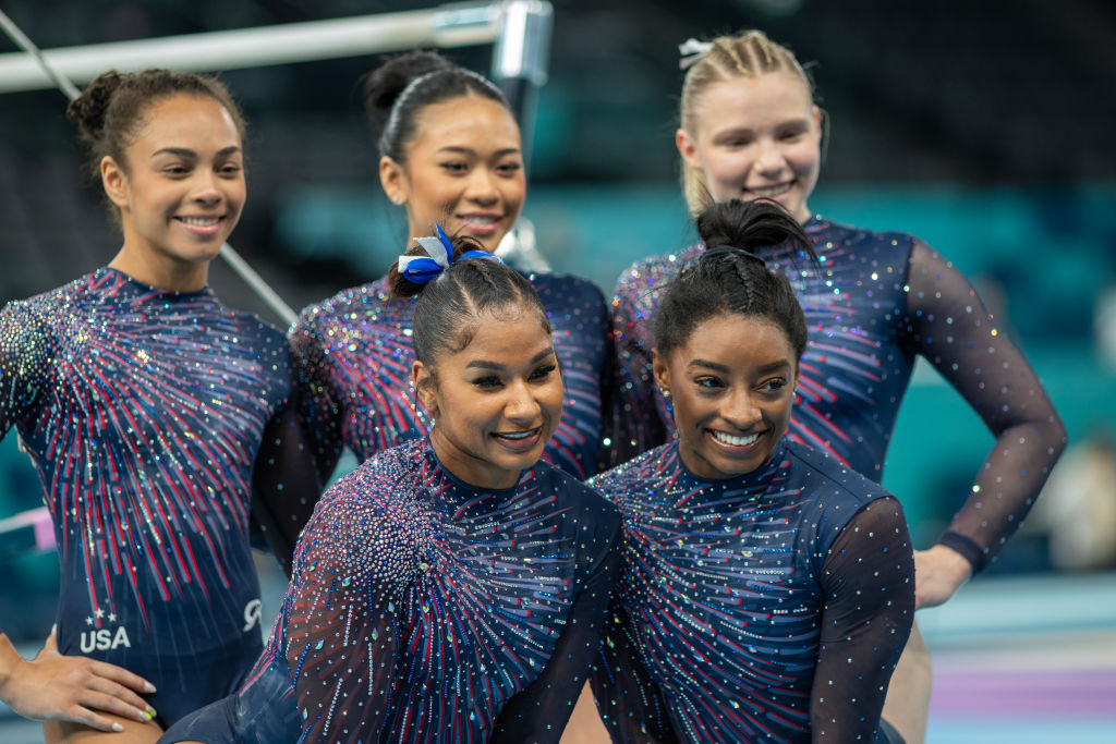 Girl Power! The Women Of Team U.S.A Unite For A Game Of ‘Pass The Phone’