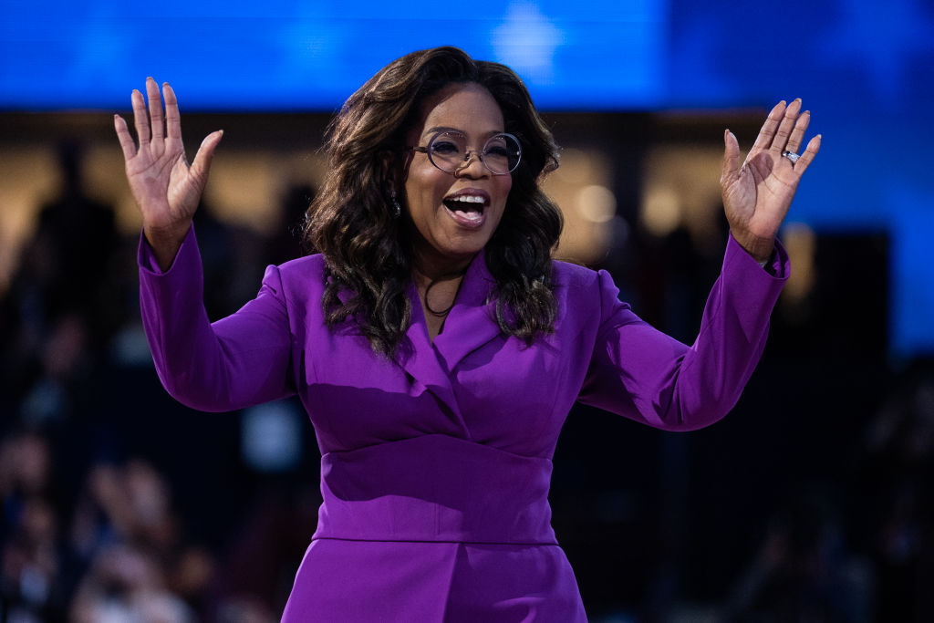 Oprah Winfrey Surprises DNC Attendees In A Stunning Purple Power Suit